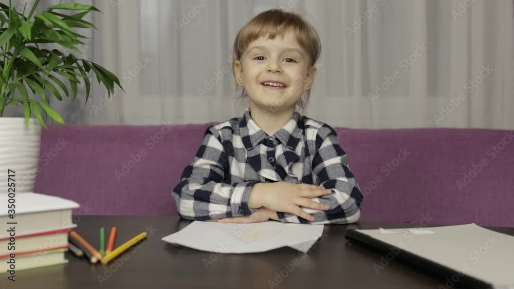 Children making video call doing distance education lessons at home. Webcam view Children making video call doing distance education lessons at home. Webcam view
