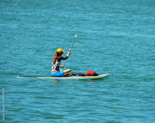 Young woman paddle boarding on Biscayne Bay off Miami Beach,Florida