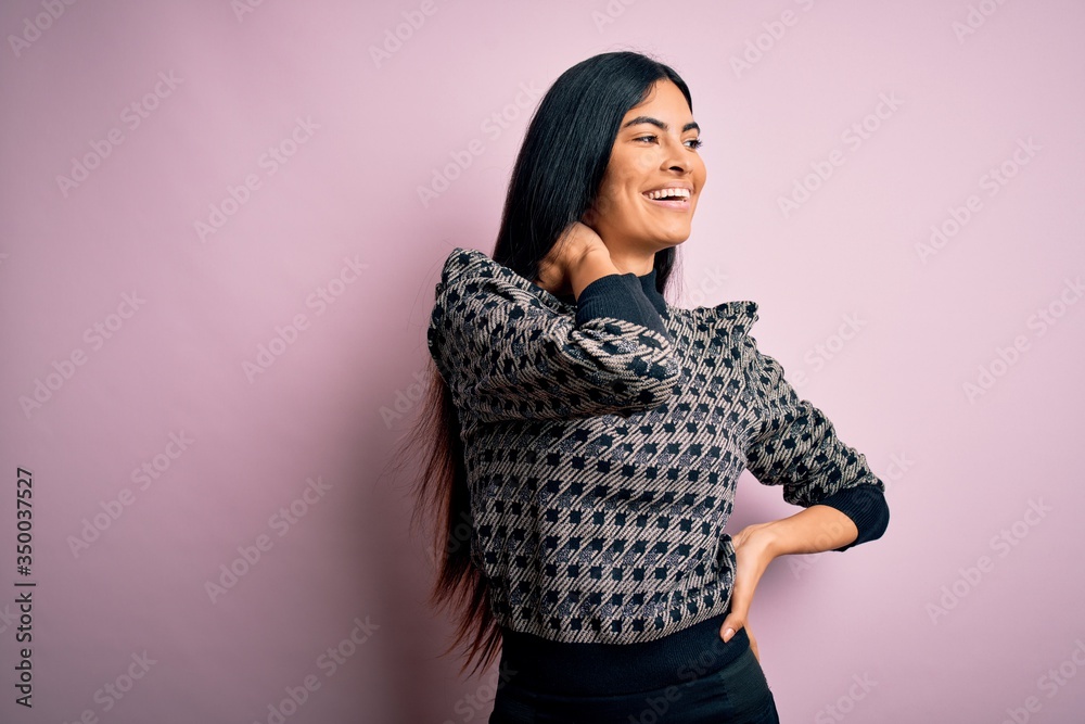 Young beautiful woman wearing fashion urban clothes, model wearing casual street style standing over pink background Young beautiful woman wearing fashion urban clothes, model wearing casual street style standing over pink background