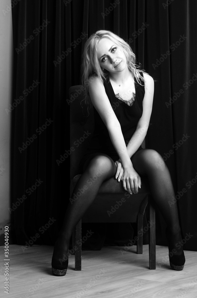 Fashion photo of young lady in elegant black dress Fashion photo of young lady in elegant black dress
