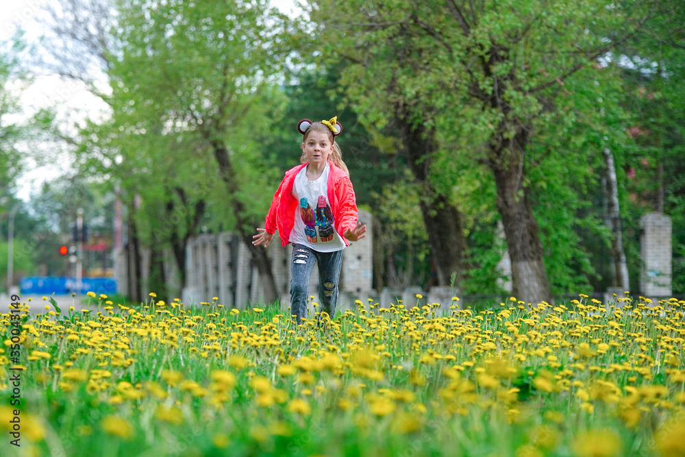 Girl on the street around the dandelions Girl on the street around the dandelions