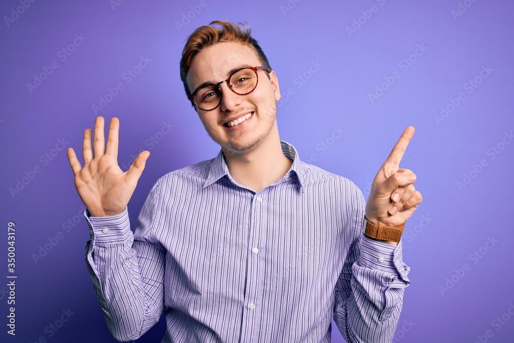 Young handsome redhead man wearing casual shirt and glasses over purple background showing and pointing up with fingers number six while smiling confident and happy. Young handsome redhead man wearing casual shirt and glasses over purple background showing and pointing up with fingers number six while smiling confident and happy.