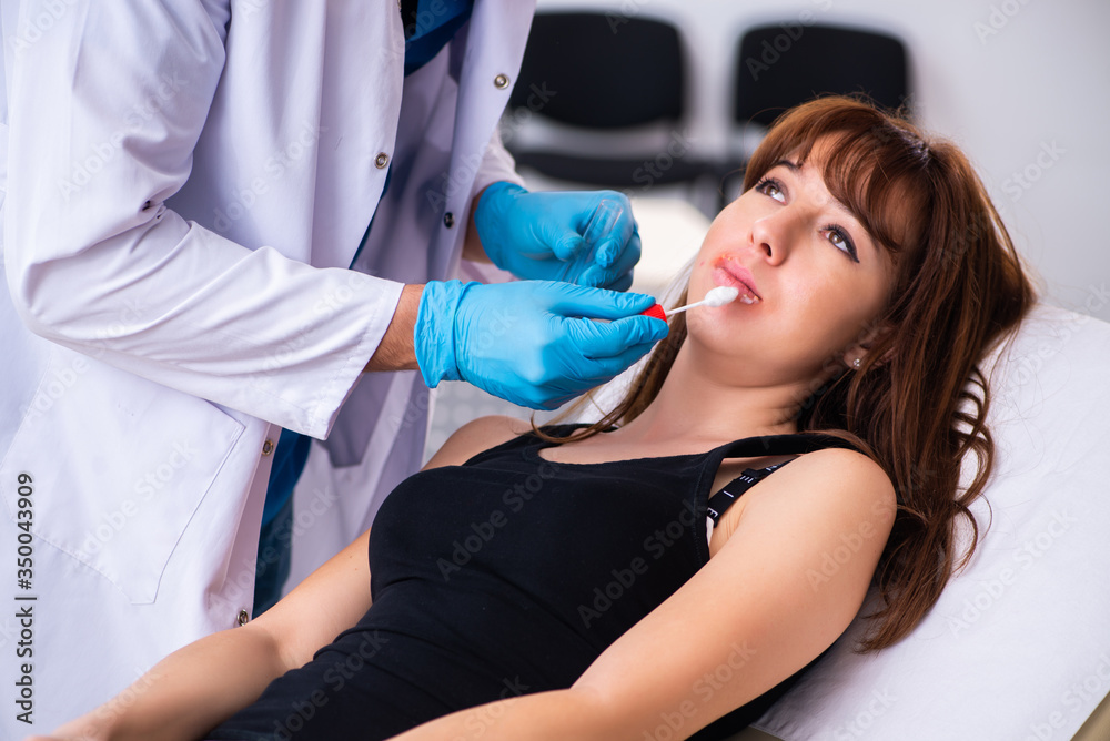 Fototapeta premium Young woman visiting male doctor dermatologist