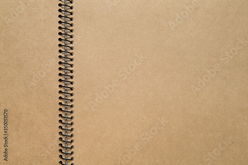 blank brown paper scrap book. close up shot. recycled paper notebook. unfolded ring book. 
