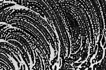 Suds bubble shampoo texture. White soap liquid foam on black background. Abstract water grunge in bath. Macro soft surface detergent pattern.