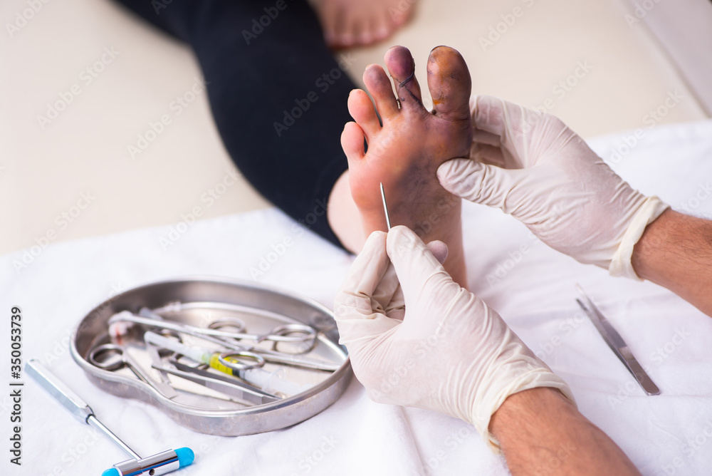 Fototapeta premium Finger injured woman visiting male doctor traumatologist