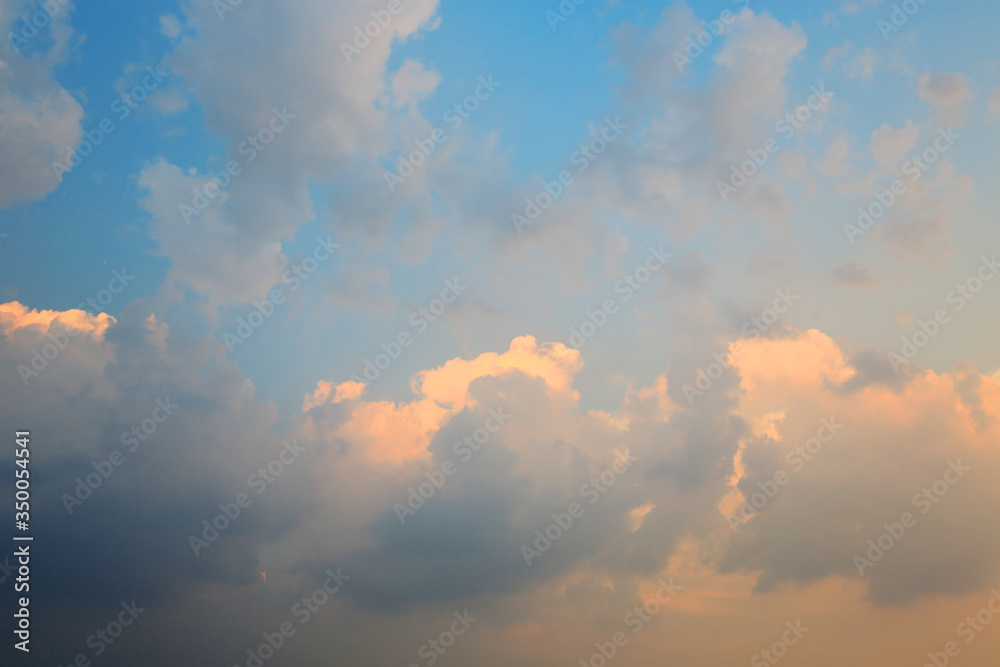 Abstract fluffy clouds on the blue sky background.