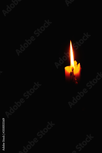 Candle light on black background.