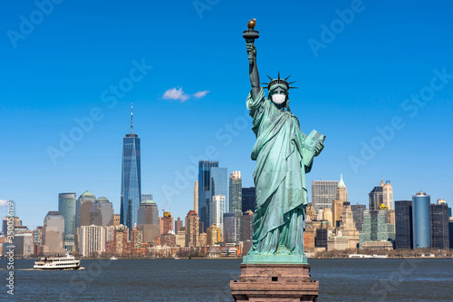 The Statue of Liberty wearing surgical mask when Covid-19 Outbreak over the Scene of New york cityscape