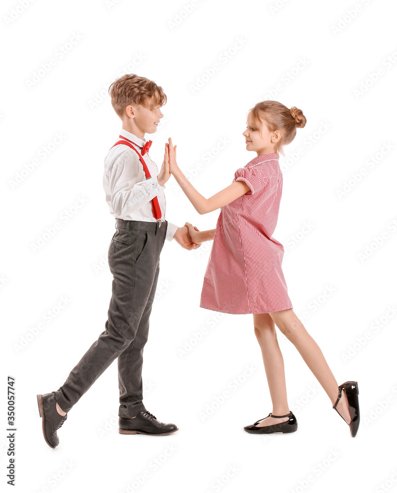 Cute little children dancing against white background Cute little children dancing against white background