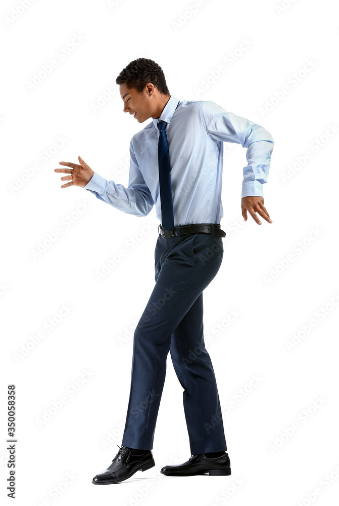 African-American teenager dancing against white background African-American teenager dancing against white background