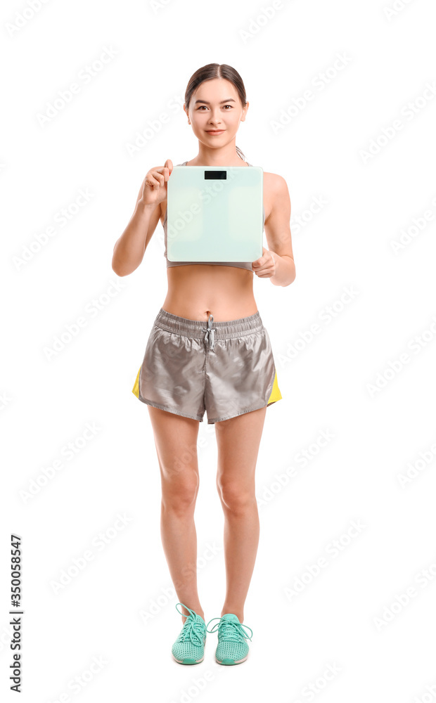 Young woman with weight scales on white background Young woman with weight scales on white background