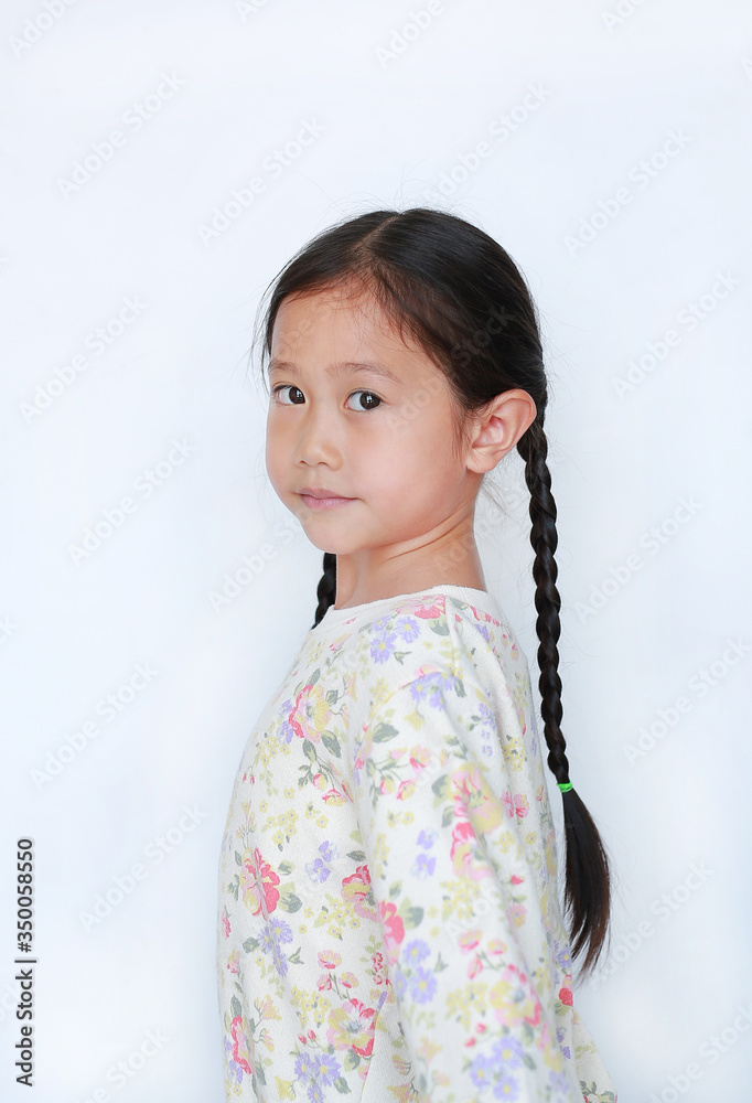 Cute asian little child girl looking camera from backside isolated on white background Cute asian little child girl looking camera from backside isolated on white background