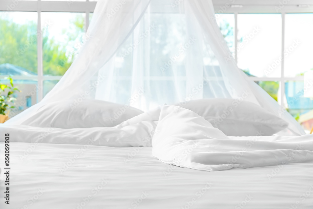 Big comfortable bed with clean linen in room Big comfortable bed with clean linen in room