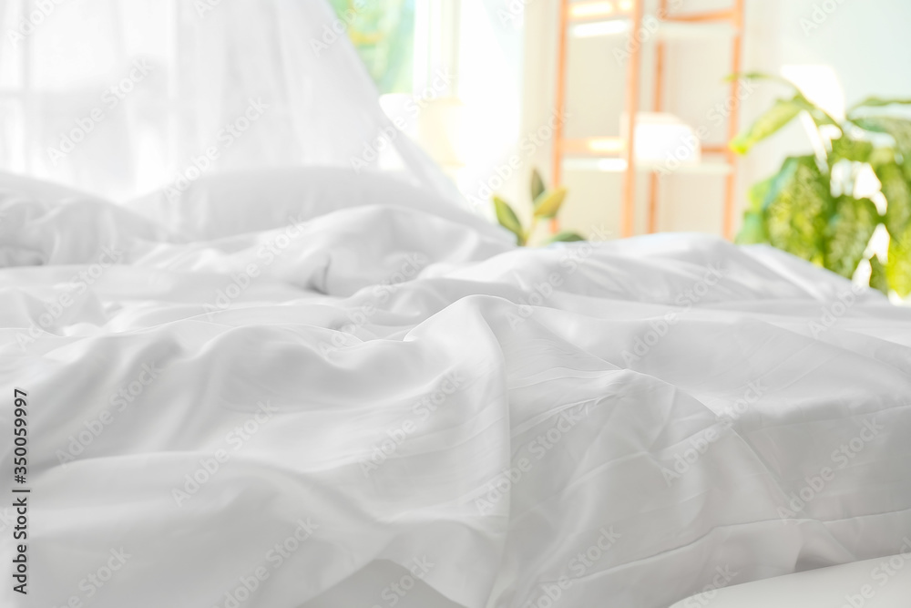 Big comfortable bed with clean linen in room Big comfortable bed with clean linen in room