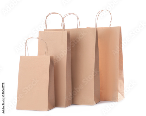 Paper shopping bags on white background