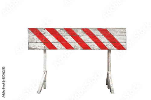 red and white striped on wooden panel barrier isolated on white background. the ban sign painted on wood plank and stand photo