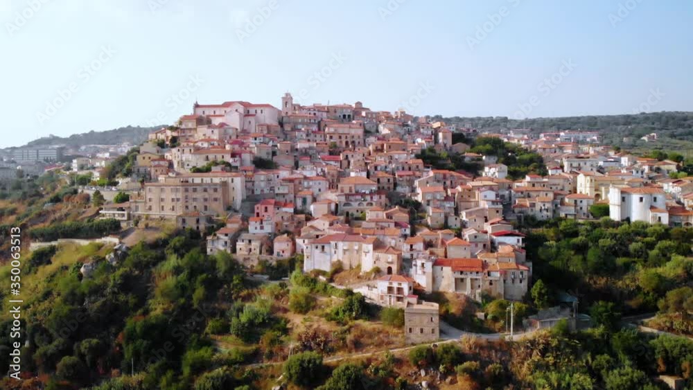 Aerial, pull back. drone shot of the Seminara muncipality, blue sky, in Calabria, south Italy Aerial, pull back. drone shot of the Seminara muncipality, blue sky, in Calabria, south Italy