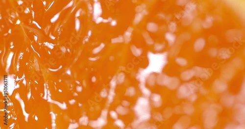 The flesh of a ripe tangerine rotates slowly.