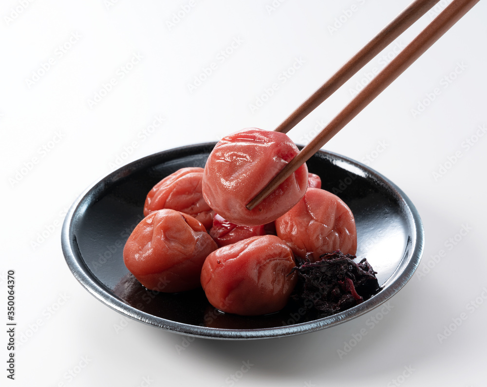 Japanese pickled plums on a white background