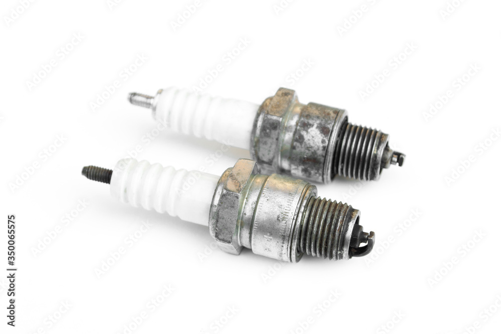 Spark plugs old isolated on a white background. Spark plugs old isolated on a white background.