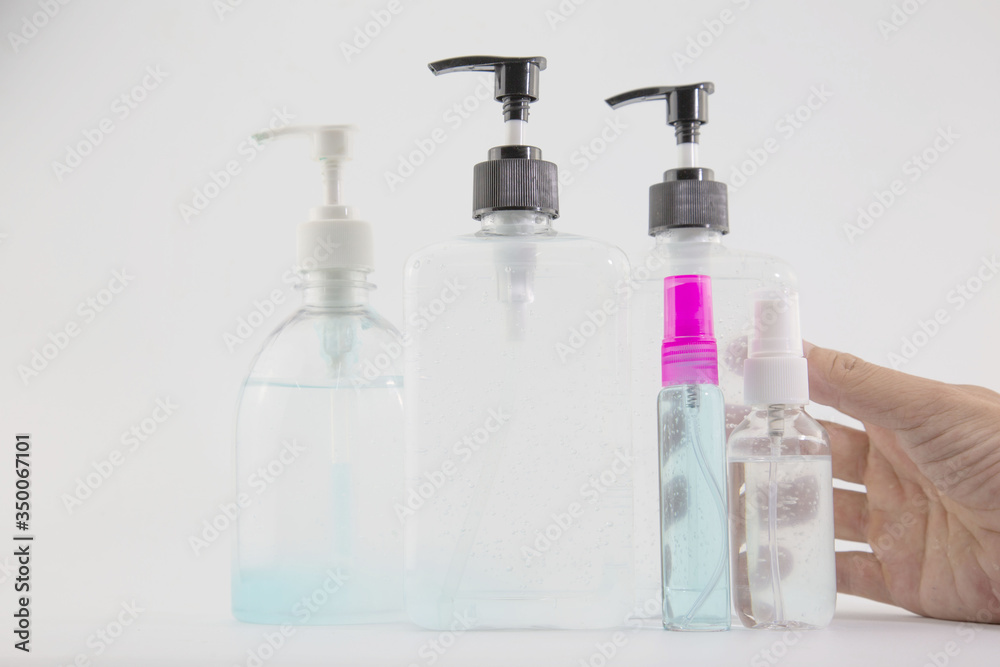 man's hand was pressing a bottle of alcohol to wash his hands to prevent Kovid 19 on a white background. man's hand was pressing a bottle of alcohol to wash his hands to prevent Kovid 19 on a white background.
