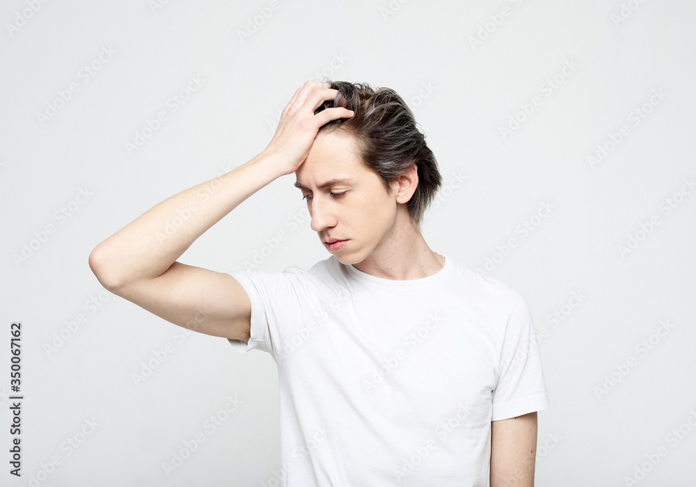 Handsome young man suffering from headache Handsome young man suffering from headache