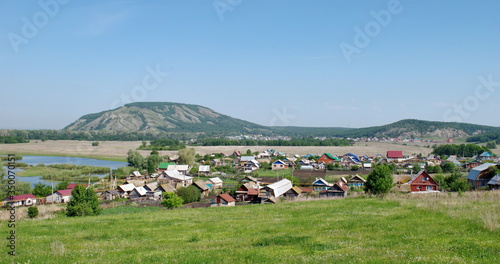 The village and the lake at the foot of the Sheehan Kush Tau. Republic of Bashkortostan. Russia.