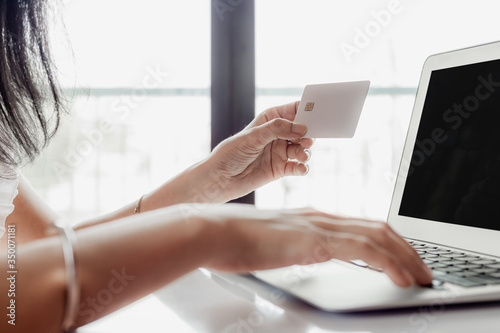 Woman's hand holding a cred...