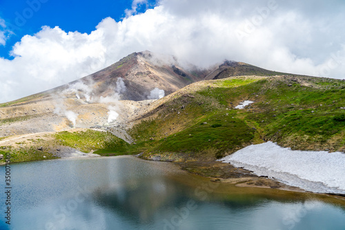 Scenery of natural and glaciers cover the lake on Asahi-dake Mountain (Mt. Asahidake), Higashikawa in summer, Highest Mountain in Hokkaido in early summer.