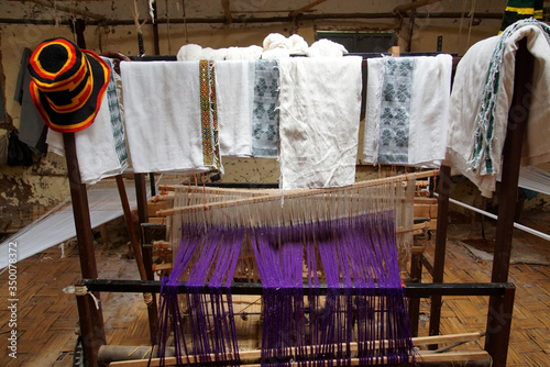 Hand-Woven Clothing hanging on a Line inside a Dorze Tribe Weaving Factory photo