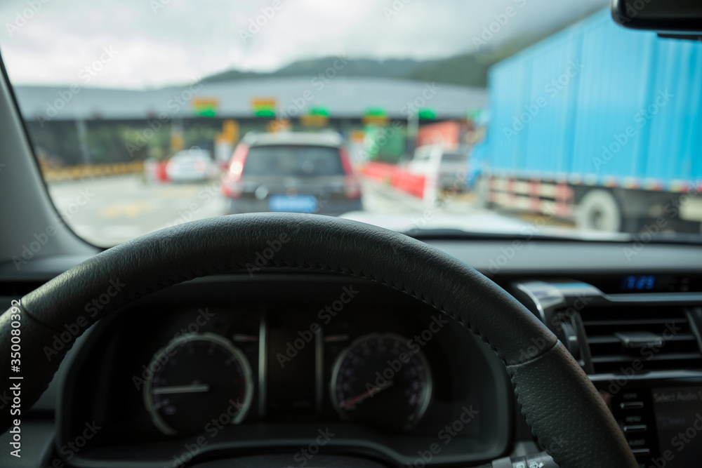 Waiting in front of the toll gate while driving car on high way road Waiting in front of the toll gate while driving car on high way road