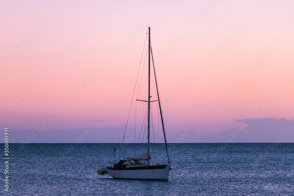 Sailing boat moored at sunrise