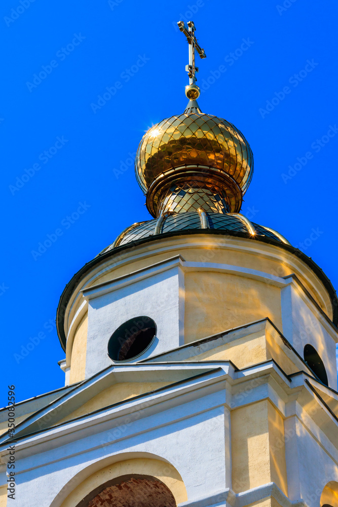 Close-up of golden cross on a dome of orthodox church