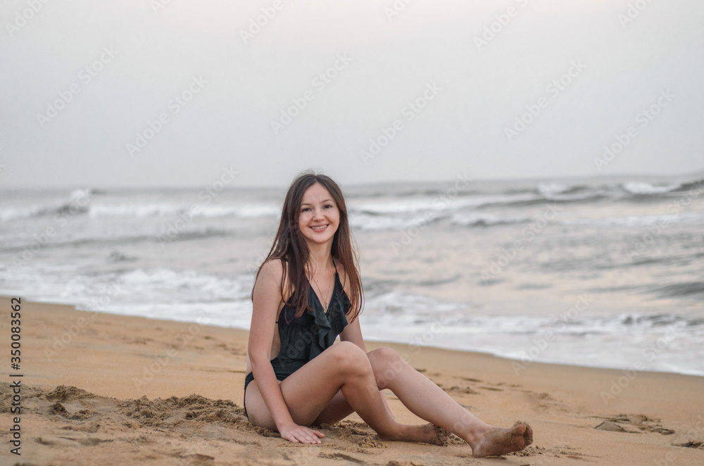 a girl on a beach near the sea a girl on a beach near the sea
