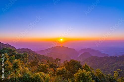 Beautiful sunrise and colorful blue sky over the hills and canyons in chiang mai,Thailand