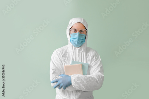 Man in biohazard suit and w...