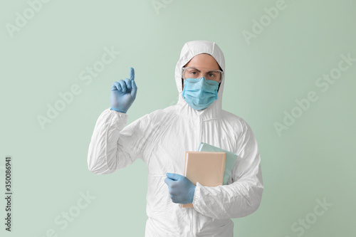 Man in biohazard suit, with...