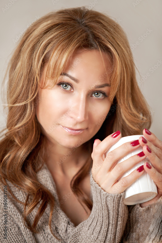 beautiful girl with a mug at home portrait