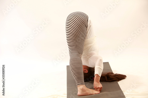 woman practices yoga or pilatis photo