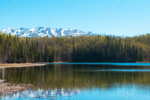 Refreshing spring day at a lake in Alaska. © GenOne360