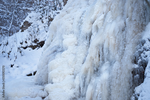 Icy waterfall on a mountain river.