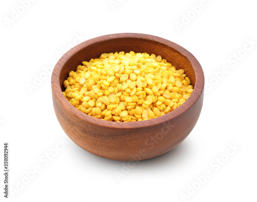 Dried mung beans peeled in a wooden bowl isolated on white background clipping path.
