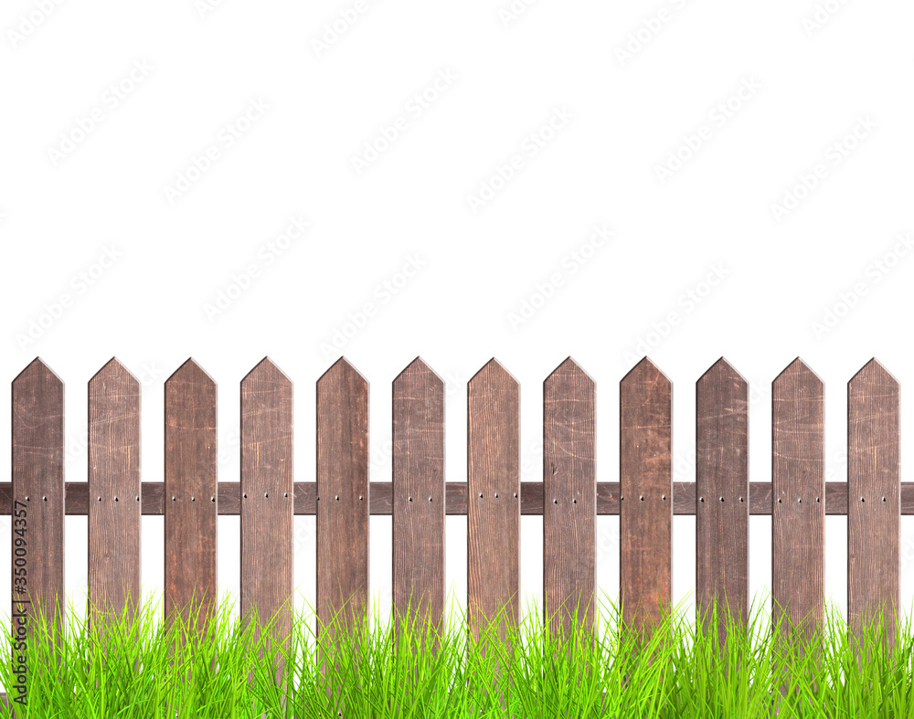 Rustic wooden fence and green grass Rustic wooden fence and green grass