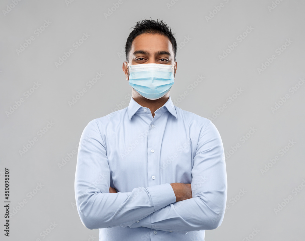business, healthcare and people concept - indian businessman in shirt wearing face medical mask for protection from virus disease over grey background business, healthcare and people concept - indian businessman in shirt wearing face medical mask for protection from virus disease over grey background