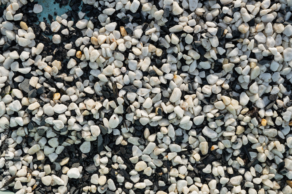Background image of small black and white round pebbles Background image of small black and white round pebbles