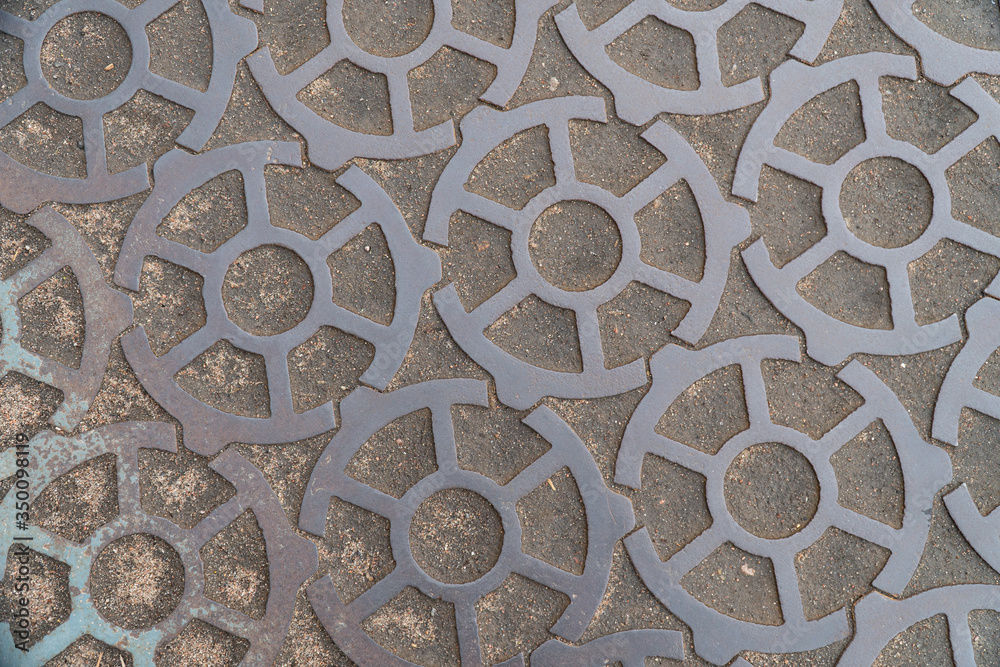 Background image of a road made of metal gears Background image of a road made of metal gears