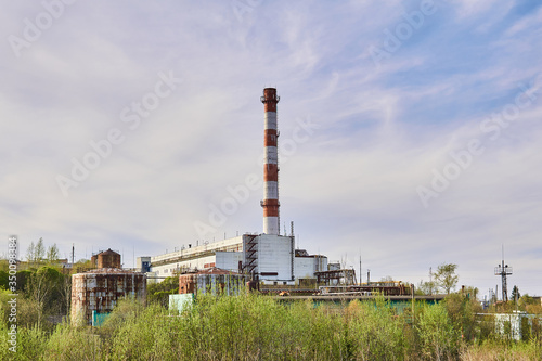 stopped cogeneration plant in spring landscape photo