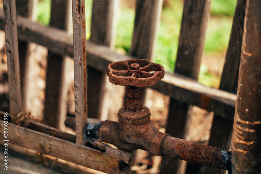 Old water tap is used as a bundle of metal structures Old water tap is used as a bundle of metal structures