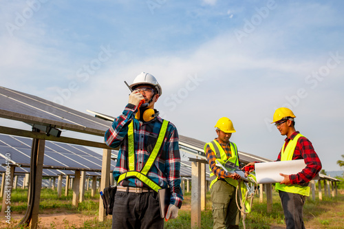 The electrician engineering working in the solar cell farm
